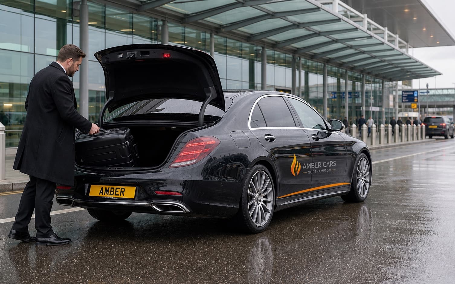 Amber Cars airport transfer vehicle with luggage at an airport terminal